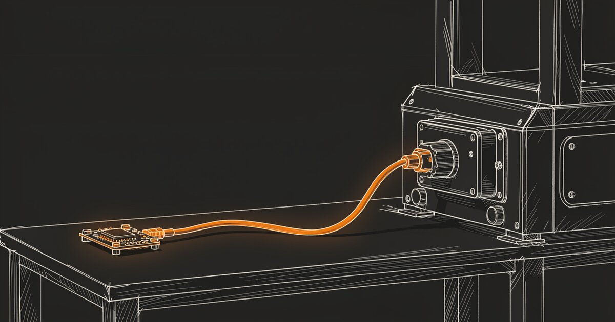 Line drawing of a workbench. A small sensor board sits at the left and a single cable curves from it to a larger machine at the right; the board and the cable glow orange while the bench and the machine stay dark.