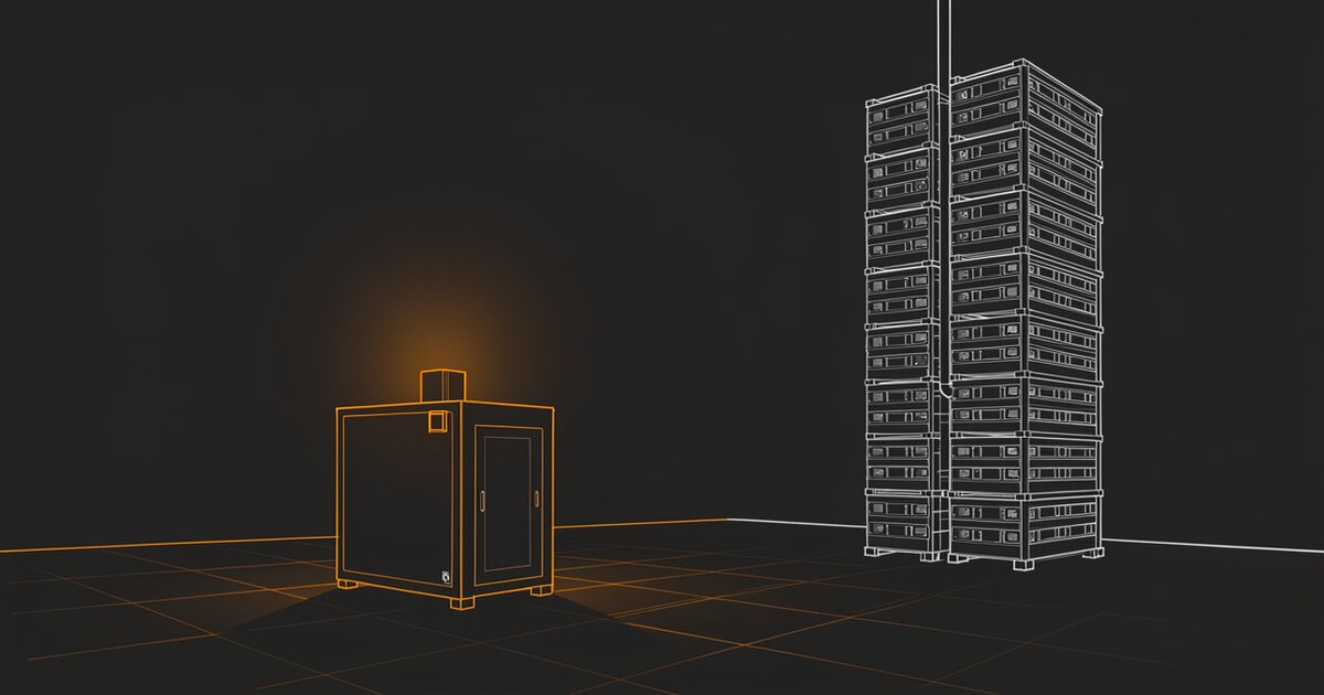 Line drawing of a small machine standing alone on a tiled floor at the left, glowing orange. A tall column of identical stacked units rises unlit at the right, with a narrow pipe running between them.